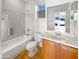 Cozy bathroom with a bathtub, toilet, and a single sink vanity at 41220 N Belfair Way, Anthem, AZ 85086