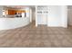 Bright living space with tiled floors, open layout and seamless flow into the kitchen at 41220 N Belfair Way, Anthem, AZ 85086