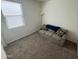 Bedroom with carpet, window with blinds, and a sofa at 4729 E Chromium Rd, San Tan Valley, AZ 85143