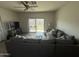 Comfortable living room with sliding glass doors to the backyard and a large sectional sofa at 4729 E Chromium Rd, San Tan Valley, AZ 85143