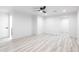 Spacious bedroom features a modern ceiling fan, luxury vinyl floors, and ample light at 5109 W Sanna St, Glendale, AZ 85302
