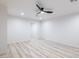 Spacious bedroom featuring a modern ceiling fan, luxury vinyl floors, and ample light at 5109 W Sanna St, Glendale, AZ 85302