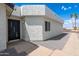 A contemporary home featuring a modern front door and neutral toned stucco exterior at 5109 W Sanna St, Glendale, AZ 85302