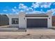 Charming single-story home featuring a modern stucco exterior and a two-car garage at 5109 W Sanna St, Glendale, AZ 85302
