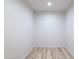 A modern, empty room with light wood floors and fresh white walls at 5109 W Sanna St, Glendale, AZ 85302