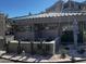 The Terrace's entrance with cacti, succulents, a tiled roof, and address signage surrounded by white gravel provides a desert charm at 5132 N 31St Way # 123, Phoenix, AZ 85016