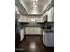 Updated kitchen features white cabinets, stainless steel appliances, and dark countertops at 5132 N 31St Way # 123, Phoenix, AZ 85016