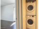 Stackable white washer and dryer are conveniently located near the main bedroom at 5132 N 31St Way # 123, Phoenix, AZ 85016