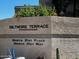 A stone sign reading Biltmore Terrace Condominiums is landscaped with plants and indicates the community's name and location at 5132 N 31St Way # 123, Phoenix, AZ 85016