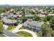 Stunning aerial view of a large home showcasing its landscaped grounds and neighborhood with mature trees and pools at 521 E Horseshoe Ave, Gilbert, AZ 85296