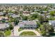 Grand aerial view of a sprawling estate displaying its lush landscaping and the community's beautiful surroundings at 521 E Horseshoe Ave, Gilbert, AZ 85296