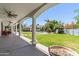 Spacious backyard patio with classic white pillars offering views of the landscaped backyard, pool, and gazebo at 521 E Horseshoe Ave, Gilbert, AZ 85296