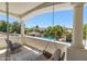 Balcony view of a swimming pool and surrounding neighborhood, offering a serene outdoor living experience at 521 E Horseshoe Ave, Gilbert, AZ 85296