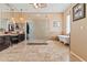 Luxurious bathroom with dual vanities, a glass-enclosed shower, and a standalone soaking tub creates a spa-like experience at 521 E Horseshoe Ave, Gilbert, AZ 85296