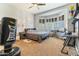 Inviting bedroom with a bay window, a ceiling fan, and carpet flooring at 521 E Horseshoe Ave, Gilbert, AZ 85296