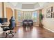 Bright dining area featuring a large bay window and stylish hardwood flooring at 521 E Horseshoe Ave, Gilbert, AZ 85296