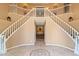 Elegant foyer with a grand staircase and decorative tile flooring at 521 E Horseshoe Ave, Gilbert, AZ 85296