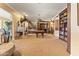 Large game room features a pool table, fireplace, mounted animal heads, and built-in bookshelves at 521 E Horseshoe Ave, Gilbert, AZ 85296