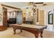 Entertain in this fun game room with a pool table, wine storage, and cozy seating area at 521 E Horseshoe Ave, Gilbert, AZ 85296