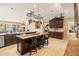 Beautiful kitchen with an oversized island, granite countertops, and stainless steel appliances at 521 E Horseshoe Ave, Gilbert, AZ 85296