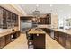 Gourmet kitchen featuring a large center island, stainless steel appliances, and custom cabinetry at 521 E Horseshoe Ave, Gilbert, AZ 85296