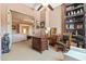 Well-appointed office space with wood desk, and shelving, connected to the Primary bedroom at 521 E Horseshoe Ave, Gilbert, AZ 85296