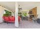 Charming outdoor living space with a stone fireplace, outdoor dining, and comfortable seating at 521 E Horseshoe Ave, Gilbert, AZ 85296