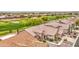 Aerial perspective of a home nestled near a golf course, with well-kept landscaping and desert charm at 5289 S Red Yucca Ln, Gold Canyon, AZ 85118