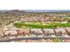 Stunning aerial view of a community situated on a golf course surrounded by desert mountains at 5289 S Red Yucca Ln, Gold Canyon, AZ 85118