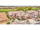 Aerial view of a charming home with a beautiful yard, complemented by surrounding neighborhood and golf course at 5289 S Red Yucca Ln, Gold Canyon, AZ 85118
