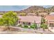 Aerial view of home with meticulously maintained landscaping and inviting backyard patio area at 5289 S Red Yucca Ln, Gold Canyon, AZ 85118