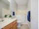 Well-lit bathroom features a walk-in tub, wooden cabinets and a mirror at 5289 S Red Yucca Ln, Gold Canyon, AZ 85118