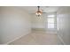 Empty bedroom features neutral walls, carpet, a window and a chandelier-style ceiling fan at 5289 S Red Yucca Ln, Gold Canyon, AZ 85118