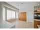 Bright dining area with large windows, built-in cabinets, and tile flooring at 5289 S Red Yucca Ln, Gold Canyon, AZ 85118