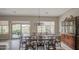 Elegant dining area with golf course views, chandelier, and adjacent hutch for ample storage at 5289 S Red Yucca Ln, Gold Canyon, AZ 85118
