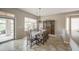 Elegant dining room with chandelier, decorative china cabinet and backyard access at 5289 S Red Yucca Ln, Gold Canyon, AZ 85118