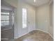 Bright foyer with decorative window, neutral paint, tile floor, and white front door at 5289 S Red Yucca Ln, Gold Canyon, AZ 85118