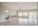 Open living area featuring tile floors, fireplace, built-in shelving, and natural light at 5289 S Red Yucca Ln, Gold Canyon, AZ 85118