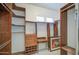 Well-organized walk-in closet with custom shelves, drawers, and ample storage space at 5289 S Red Yucca Ln, Gold Canyon, AZ 85118