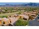 Aerial view of community, golf course, and mountains at 5370 S Desert Dawn Dr # 30, Gold Canyon, AZ 85118