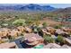 Aerial view showcases the community layout, mature landscaping, and mountain backdrop at 5370 S Desert Dawn Dr # 30, Gold Canyon, AZ 85118