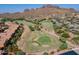 Aerial view showcases golf course with a beautiful desert landscape at 5370 S Desert Dawn Dr # 30, Gold Canyon, AZ 85118