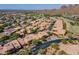 Scenic aerial view of charming neighborhood surrounded by the golf course and mountain views at 5370 S Desert Dawn Dr # 30, Gold Canyon, AZ 85118