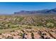 Stunning aerial view of luxury homes in a golf community, set against the backdrop of majestic mountains at 5370 S Desert Dawn Dr # 30, Gold Canyon, AZ 85118