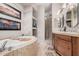 Serene bathroom featuring a soaking tub, tiled shower, and double sink vanity for a spa-like experience at 5370 S Desert Dawn Dr # 30, Gold Canyon, AZ 85118