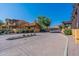 View of well-maintained community entrance with lush landscaping and gate at 5370 S Desert Dawn Dr # 30, Gold Canyon, AZ 85118