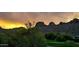 Scenic desert landscape with mountains in the backdrop under a vibrant sunset, highlighting the natural beauty at 5370 S Desert Dawn Dr # 30, Gold Canyon, AZ 85118
