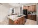 Lovely eat-in kitchen with stainless steel appliances, an island with seating and gorgeous countertops at 5370 S Desert Dawn Dr # 30, Gold Canyon, AZ 85118