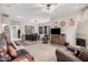 Spacious living room with a ceiling fan, fireplace, and comfortable seating, perfect for relaxation at 5370 S Desert Dawn Dr # 30, Gold Canyon, AZ 85118