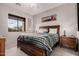 Inviting main bedroom showcasing a queen bed, stylish decor, a window view, and bedside tables at 5370 S Desert Dawn Dr # 30, Gold Canyon, AZ 85118